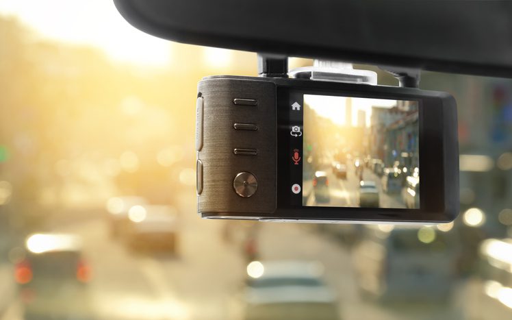 Digital video recorder car camera for safety on the road accident, Technology recorder device capturing video of front of vehicle automobile crash safety proof evidence.